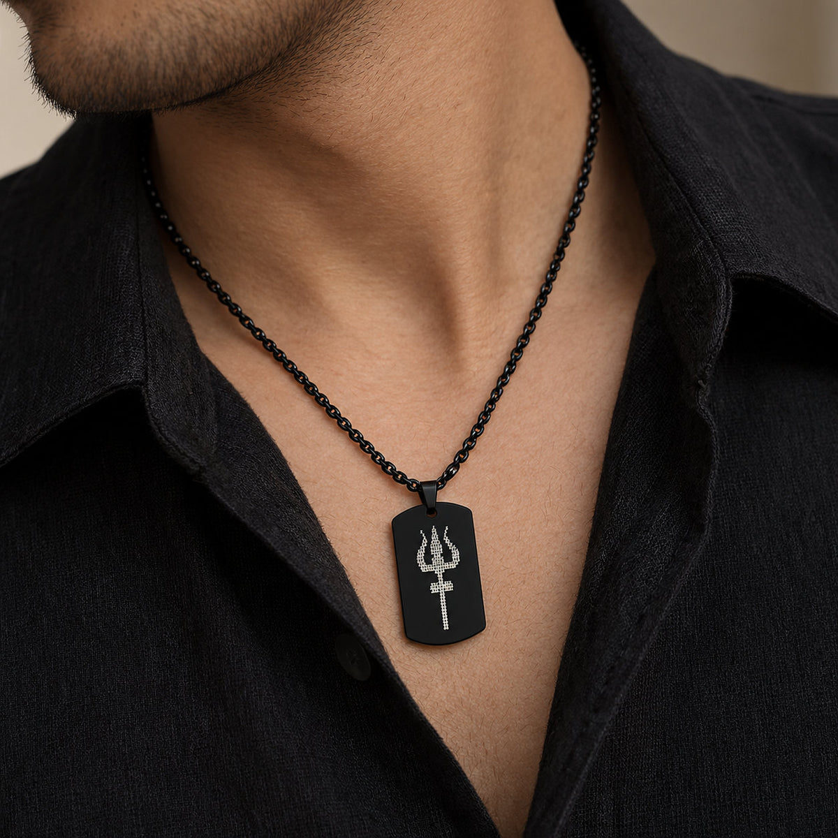 Man wearing black Mahadev Trishul tag pendant over black shirt