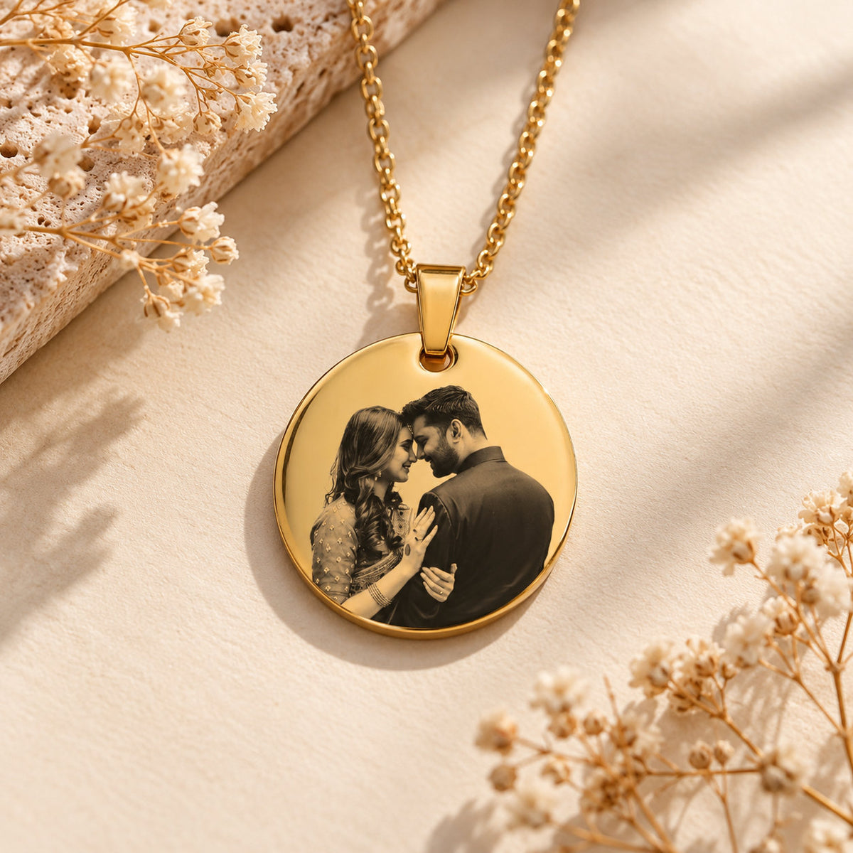 Gold round photo coin pendant with a different engraved couple photo