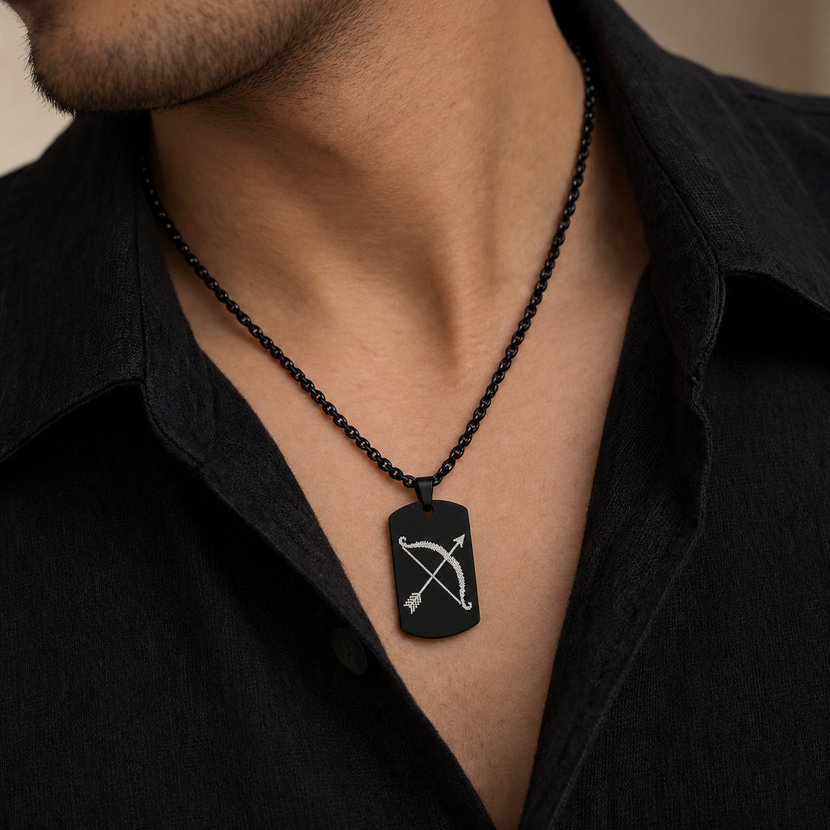 Man wearing black Shri Ram dhanush tag pendant over black shirt
