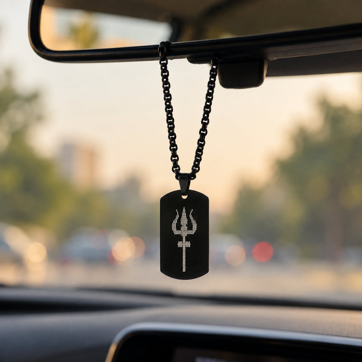 Black Mahadev Trishul tag pendant hanging from car rear-view mirror