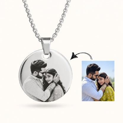 Silver coin pendant showing a customer photo turned into engraving